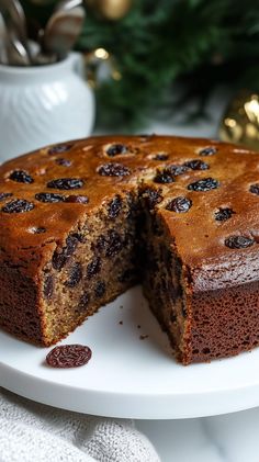 a chocolate cake on a plate with one slice cut out