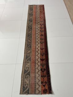 an old rug is laying on the floor