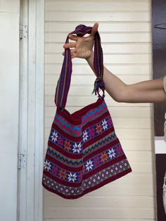 "Beautiful woven handcrafted bag up for grabs! Features a crossbody/shoulder strap design, one large main open interior compartment--no closure or pockets. Zigzag, flower, diamond colorful pattern in maroon, blue, red, green, white + orange. Thick, tightly woven material + quality made. No tag on garment.  width: 30\" height: 12.25\" handle drop: 22\" strap width: 2\" Condition: Amazing quality + condition. No discrepancies with bag." Hippie Flowers, Handcrafted Bags, Market Bag, Vintage Gifts, Flower Pattern, Zig Zag, Color Patterns, Flower Patterns, Purses And Handbags