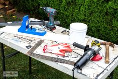 tools are sitting on top of a table outside