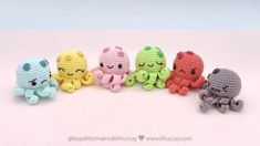 small crocheted stuffed animals lined up in a row