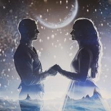 two people standing next to each other in front of a moon and stars filled sky