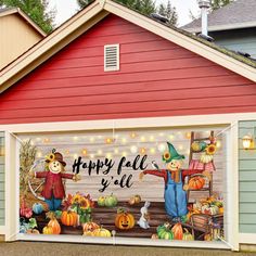 a garage decorated for halloween with pumpkins and scarecrows painted on the side