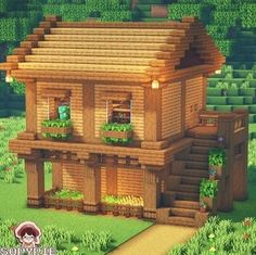 a house made out of wood in the middle of some green plants and grass with stairs leading up to it