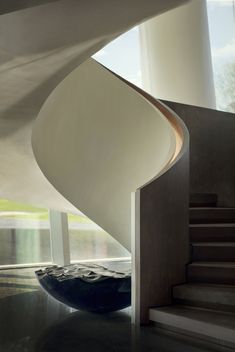 a spiral staircase in a modern house