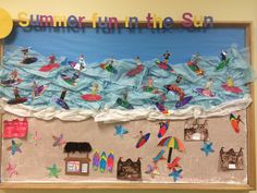 a bulletin board is decorated with beach scenes and people on surfboards in the ocean