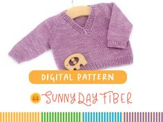 a knitted sweater with a wooden button on it and the words digital pattern sunny day free