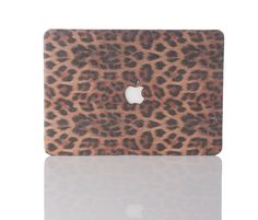 an animal print macbook case with the apple logo on it