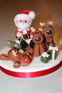 a christmas cake with santa claus and reindeers