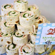 there are many rolls stacked on top of each other in the shape of a monkey