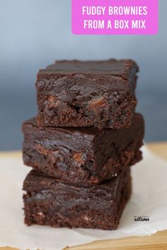 fudgy brownies from a box mix are stacked on top of each other