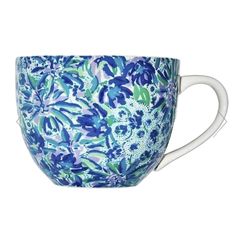 a blue and white cup with flowers on it