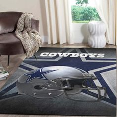 a rug with a football helmet on it and the word cowboys written in large letters