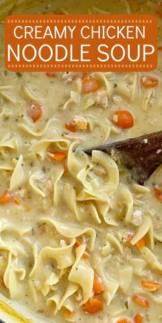 creamy chicken noodle soup in a yellow bowl with a wooden spoon on the side