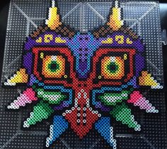 an image of a colorful butterfly made out of perler beads