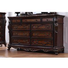 a large wooden dresser sitting on top of a hard wood floor