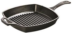 an empty frying pan with a grill on the bottom and handle to hold it