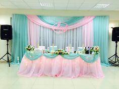 a table is set up with pink and blue linens for a wedding breakfasteon