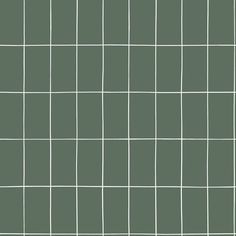 a green tiled wall with white lines on the top and bottom, as well as small squares