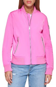 This contemporary bomber jacket is a stylish outerwear staple that exudes menswear-inspired charm. 22.5" length (size S) Varsity collar Long sleeves with zip cuffs Front zip closure Front zip pockets 100% polyester Machine wash, tumble dry Imported Model Stats: 5'10" height; 34" bust; 27" waist; 35" hips. Model is wearing size S. Flight Jacket, Levis Women, Menswear Inspired, Jackets Online, Swimsuit Tops, Flight, Zip Pockets, Levi's, Emerald