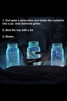 three mason jars filled with blue and white glitters, one is holding the jar