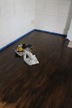 an empty room with wood flooring and white paint on the walls is being remodeled