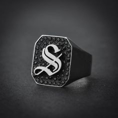 A handmade sterling silver 925 octagon shape old english letter signet ring with black stones.Each ring is cleaned and polished with care.The weight of the ring may vary according to size.Aprrox weight: 8.15grMeasurements: Width - 14.5mm | Height - 16.5mmThe ring is made of sterling silver 925 and is water resistant.The ring is set with black zircons.This ring is available in more shapes!Oval> https://www.etsy.com/il-en/listing/579579043/oval-letter-signet-ring-initial-ringRectangle> https Black Personalized Sterling Silver Signet Ring, Black Initial Ring With Polished Finish As Gift, Black Engraved Ring With Initials As Gift, Gift Black Initial Ring With Polished Finish, Personalized Black Jewelry For Streetwear, Classic Black Monogram Jewelry, Classic Black Monogrammed Jewelry, Black Sterling Silver Jewelry With Initials, Silver Initial Ring