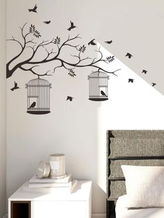 a bedroom wall with birds in cages on it