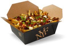 a box filled with french fries covered in sauce and toppings on top of it