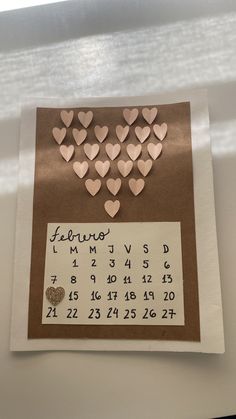 a calendar with hearts attached to it