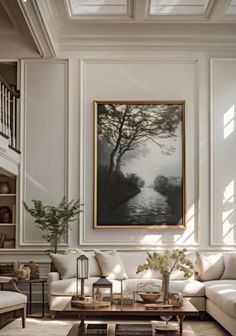 a living room filled with furniture and a painting on the wall