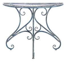 a metal table with an ornate design on it's top and bottom, against a white background