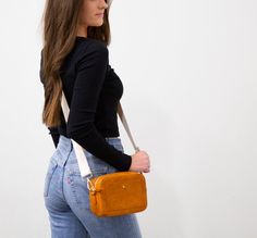 "This new addition to our Wanderlust collection is perfect to hold your phone, keys, and even your camera! This is the perfect size crossbody to just grab and go. Perfect for grabbing a coffee, heading to the beach, or sight seeing with friends. This Wanderlust Camera Bag will be sure to add convince and style to your outfit.  *Dimensions - H5\" X W8\"X D3\"* *Comes with crossbody strap shown.* *Made with vegan friendly faux leather.* *Available with 6 different color options.* *Styling tip: buy Camera Bag Purse, Sight Seeing, Women Crossbody Bag, Small Crossbody Purse, Leather Fanny Pack, Festival Bag, Leather Tassel, Personalize Bag, Custom Bags