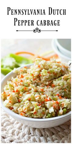 a white bowl filled with coleslaw and carrots on top of a table