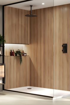 a bathroom with wood paneling and plants on the shelves next to the bathtub