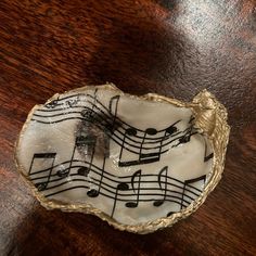 a small bowl with musical notes on it