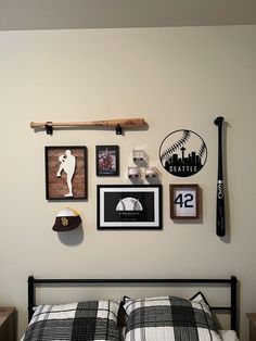 a baseball themed bedroom with pictures on the wall