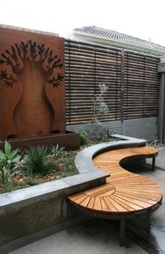 a wooden bench sitting next to a garden