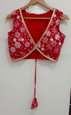 This Made to Order/Made to Measurement/Custom Made Indian Ethnic Blouse. - Fabric - Embroidered Georgette - Color  Red color - Princess Cut - Rich Lined - Shoulder string with latkans - Sleeveless - Extra margin and extra stitches included in the blouse - It can be customize in any color, design or size  MEAUREMENTS & CUSTOMIZATIONS This blouse can be purchased in your standard sizing and pattern. Please choose your Chest Size (measured in inches) from the drop-down box.. For custom sizing please include the below measurements in the the notes to whenever you placed the order. * Chest size: * Waist size: * Blouse Length: * Bicep: * Arm-hole: * Sleeve Length: * Front Neck Depth: * Back-Neck Depth:  Sleaves Around PLEASE NOTE: BUYERS ARE RESPONSIBLE FOR ANY CUSTOMS AND IMPORT TAXES THAT MAY Red Bohemian Blouse For Puja, Festive V-neck Choli With Mirror Work, Festive Red Choli With Floral Embroidery, Red Floral Embroidered Choli For Festive Occasions, Navratri Choli With Floral Embroidery, Red Saree Choli With Floral Embroidery, Red Floral Embroidered Saree Choli, Bollywood Style Red Embroidered Top, Festive Bohemian V-neck Choli