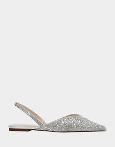 a pair of women's silver shoes with sequins on the toe and heel