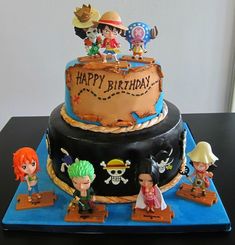 a birthday cake with pirate figures on it