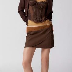 Lioness Mini Skirt Crafted From Luxe Faux Leather. Short + Slim-Fitting Throughout With A Low-Rise And A Wrap Detail At The Front. Topped With Studs On The Contrasting Waistband. High Waist Brown Mini Skirt For Party, Brown High Waist Mini Skirt For Party, Elegant Brown Mini Bottoms, Mini Skirt With Belt For Fall, Fitted Mini Skirt With Belt For Workwear, Fitted Mini Skirt With Belt For Fall, Fitted Mini Skirt With Belt For Night Out, Fitted Asymmetrical Mini Skirt For Fall, Chic Fitted Mini Skirt With Belt