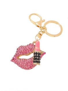 a pink lipstick bottle shaped keychain on a white background