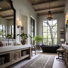 a bath room with a tub a sink and a window