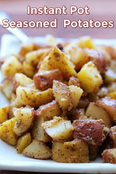 a white plate topped with potatoes on top of a wooden table and text overlay that reads instant pot seasoned potatoes