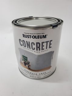 a white paint can with the words rustfolemum on it and a green chair