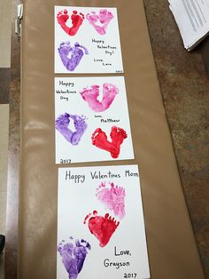 three handprints are displayed on the table for valentine's day crafts and activities