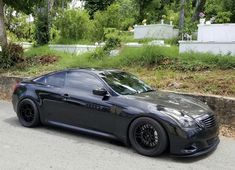 a black sports car parked on the street