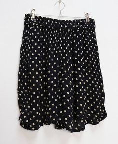 "a vintage pair of black and white polka-dot shorts ✿ IMPORTANT INFORMATION: * excellent vintage condition * size: small - please check exact measurements below (they're there for your benefit!) * hip pockets ✿ MEASUREMENTS (taken while item is lying flat, some measurements will need to be doubled): * waist: 12-17\" (30-43cm) - elasticated * hips: 29\" (74cm) * front rise: 14.5\" (37cm) * back rise: 16.5\" (42cm) * leg in-seam: 4\" (10cm) * leg out-seam: 17.5\" (44cm) * thigh width: 16\" (41cm) Retro Black Spring Shorts, Vintage Black Shorts For Summer, Retro Black Summer Bottoms, Vintage Black Bottoms For Summer, Retro Black Short Bottoms, Vintage Black Summer Bottoms, Black Vintage Summer Bottoms, Retro Polka Dot Bottoms For Summer, Retro Polka Dot Summer Bottoms