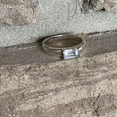 Minimalist Faux Emerald cut CZ diamond set in sterling silver 925 Uniquely designed handmade artisan ring, stackable ring. Vintage from the 70s signed 925 plus the jeweler's stamp. size ring is US 6 3/4 and UK N Good condition with a bit of patina of age. This can be cleaned and it will look new or leave the way it is . engagement ring , Friendship ring, love ring, just because I love you ring. I Love You Ring, Friendship Ring, Casual Earrings, Friendship Rings, Niagara Falls Ny, Artisan Rings, Because I Love You, Emerald Cut Diamond, Metal Ball